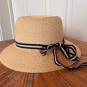 Stylish Tan Straw Hat with Black Ribbon